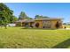 Single-story home with stone accents and a large yard at 12377 Fillmore St, Spring Hill, FL 34609