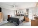 Bright main bedroom with a ceiling fan and en-suite bathroom access at 12377 Fillmore St, Spring Hill, FL 34609