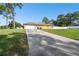 View of the home's garage and driveway at 12377 Fillmore St, Spring Hill, FL 34609