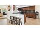 Kitchen with breakfast bar and dark wood cabinets at 12377 Fillmore St, Spring Hill, FL 34609