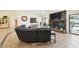 Living room with stone fireplace and view of kitchen at 12377 Fillmore St, Spring Hill, FL 34609