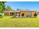 Single-story home with stone accents and a large yard at 12377 Fillmore St, Spring Hill, FL 34609