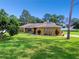 One-story home with stone accents and lush lawn at 12377 Fillmore St, Spring Hill, FL 34609