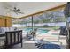 Inviting pool area with screened enclosure, creating a private oasis at 12377 Fillmore St, Spring Hill, FL 34609