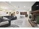 Open living room with a cozy fireplace and a view into the kitchen at 12377 Fillmore St, Spring Hill, FL 34609