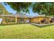 Single-story home with stone accents and a large yard at 12377 Fillmore St, Spring Hill, FL 34609