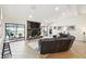 Living room with stone fireplace, sectional sofa, and pool view at 12377 Fillmore St, Spring Hill, FL 34609