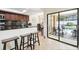 Kitchen with breakfast bar and view of the backyard pool and patio at 12377 Fillmore St, Spring Hill, FL 34609