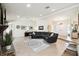 Spacious living room with a stone fireplace and large sectional sofa at 12377 Fillmore St, Spring Hill, FL 34609