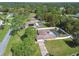 Aerial view of two homes with pools in a lush, tree-lined neighborhood at 12377 Fillmore St, Spring Hill, FL 34609
