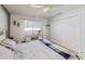 Bedroom with queen bed, built-in shelving, and large closet at 12377 Fillmore St, Spring Hill, FL 34609