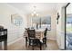Bright dining room featuring a table with seating for four and an adjacent view of the pool at 12377 Fillmore St, Spring Hill, FL 34609