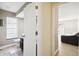 View into bathroom and bedroom from hallway at 12377 Fillmore St, Spring Hill, FL 34609