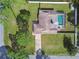 An aerial view showcasing a house with a pool and a large backyard at 12377 Fillmore St, Spring Hill, FL 34609