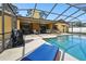 Enclosed pool and patio area, great for relaxing and entertaining at 12377 Fillmore St, Spring Hill, FL 34609