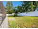 Landscaped backyard with a shed and fence at 12377 Fillmore St, Spring Hill, FL 34609