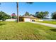 View of the home's garage and driveway at 12377 Fillmore St, Spring Hill, FL 34609