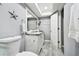 Clean bathroom with updated vanity and tiled flooring at 12377 Fillmore St, Spring Hill, FL 34609