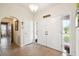Well-lit entryway with tile flooring and access to other rooms at 12377 Fillmore St, Spring Hill, FL 34609