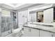 Modern bathroom with a granite countertop and a walk-in shower at 12377 Fillmore St, Spring Hill, FL 34609