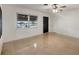 Bright living room with terrazzo floors and ceiling fan at 2821 54Th N St, St Petersburg, FL 33710