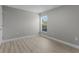 Bright bedroom with a window and neutral walls at 3841 San Pedro Ave, North Port, FL 34288