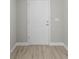 Interior entry door with light colored wood-look flooring at 3841 San Pedro Ave, North Port, FL 34288