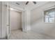 Spacious bedroom with French doors and ceiling fan at 7615 Campus Cv, Sarasota, FL 34243