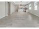 Spacious dining room with tile floors and an open view to the kitchen at 7615 Campus Cv, Sarasota, FL 34243