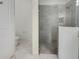 Clean bathroom with toilet and walk-in shower at 7615 Campus Cv, Sarasota, FL 34243