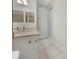 Modern bathroom with white vanity and tile floors at 7615 Campus Cv, Sarasota, FL 34243