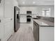 Modern kitchen with stainless steel appliances and granite countertops at 7615 Campus Cv, Sarasota, FL 34243