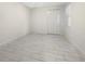 Simple bedroom with tile floors and a double door closet at 7615 Campus Cv, Sarasota, FL 34243