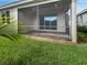 Relaxing screened-in porch, perfect for enjoying the outdoors at 7615 Campus Cv, Sarasota, FL 34243