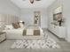 Large main bedroom with plush carpet and an ensuite bathroom at 7615 Campus Cv, Sarasota, FL 34243