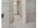 Hallway with access to bedrooms, bathroom and laundry at 7615 Campus Cv, Sarasota, FL 34243