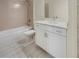 Clean bathroom with white vanity, tub, and shower at 7615 Campus Cv, Sarasota, FL 34243