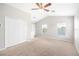 Spacious bedroom with vaulted ceiling, large windows, and double-door closet at 11354 78Th E St, Parrish, FL 34219