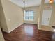 Simple dining area with hardwood floors and large window at 7001 Interbay Blvd # 210, Tampa, FL 33616