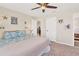 Guest bedroom with beach theme decor, king-size bed, and access to a bathroom at 265 Belvedere Ct, Punta Gorda, FL 33950