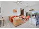 Bright living room with sectional sofa and view of the pool at 265 Belvedere Ct, Punta Gorda, FL 33950