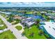 Aerial view of waterfront home with canal access and lush landscaping at 265 Belvedere Ct, Punta Gorda, FL 33950