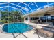 Relaxing screened pool and patio area with lounge chairs at 265 Belvedere Ct, Punta Gorda, FL 33950