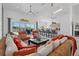 Open living space with kitchen, sectional, and pool view at 265 Belvedere Ct, Punta Gorda, FL 33950