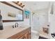 Modern bathroom with double vanity, marble shower, and pebble flooring at 265 Belvedere Ct, Punta Gorda, FL 33950