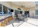 Covered lanai with barstools and a table with seating at 265 Belvedere Ct, Punta Gorda, FL 33950