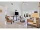 Cozy living room featuring comfortable seating, a large TV, and a bay window at 265 Belvedere Ct, Punta Gorda, FL 33950