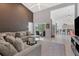 Spacious living area with sectional sofa and access to a pool and kitchen at 265 Belvedere Ct, Punta Gorda, FL 33950