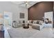 Large living room with sectional sofa and a view into other rooms at 265 Belvedere Ct, Punta Gorda, FL 33950