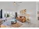 Relaxing living room with comfortable seating, a large window, and stylish decor at 265 Belvedere Ct, Punta Gorda, FL 33950
